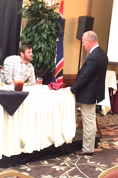 2015 Colton Sasser and Wyoming Governor, Matt Mead, visit at the Wyoming Stock Growers Association Winter Roundup