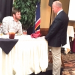 2015 Colton Sasser and Wyoming Governor, Matt Mead, visit at the Wyoming Stock Growers Association Winter Roundup