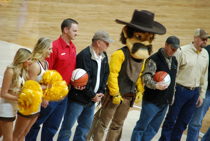 2016 Dan Currah, Hunting with Heroes co-founder, and Bill Brinegar, Wyoming game warden, recognized at Wyoming Cowboys basketball game