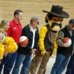 2016 Dan Currah, Hunting with Heroes co-founder, and Bill Brinegar, Wyoming game warden, recognized at Wyoming Cowboys basketball game