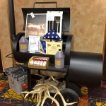 Auction package: Smoker donated by Moberg Smokers, with a whole pig, fixins and tools, with American Flag presented by US Senator John Barrasso